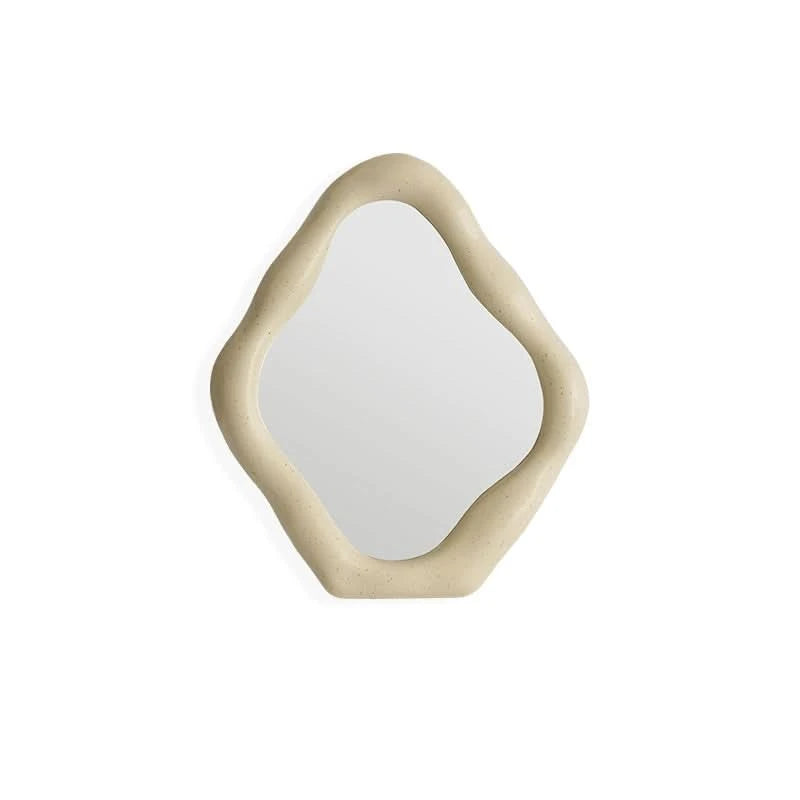 Abstract beige textured vanity mirror with an irregular shape.